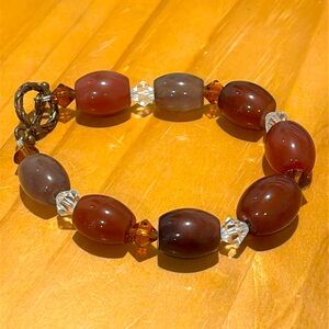 Glass bead bracelet with clasp closure.